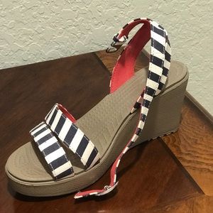 Size 7, woman’s wedge sandals.
